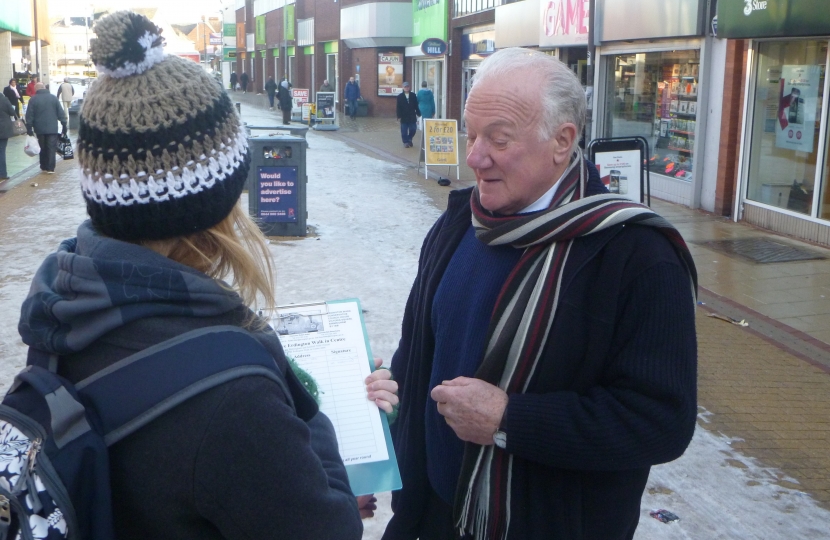 Bob with local resident who is signing the petition to save the Walk in Centre