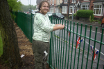 A wet Cllr Robert Alden putting up bunting before the event