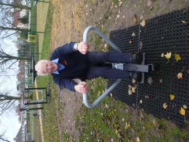 Bob hard at work testing the new rowing machine in the gym section of the park