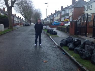 Gareth by the dumped rubbish on Dunvegan Road